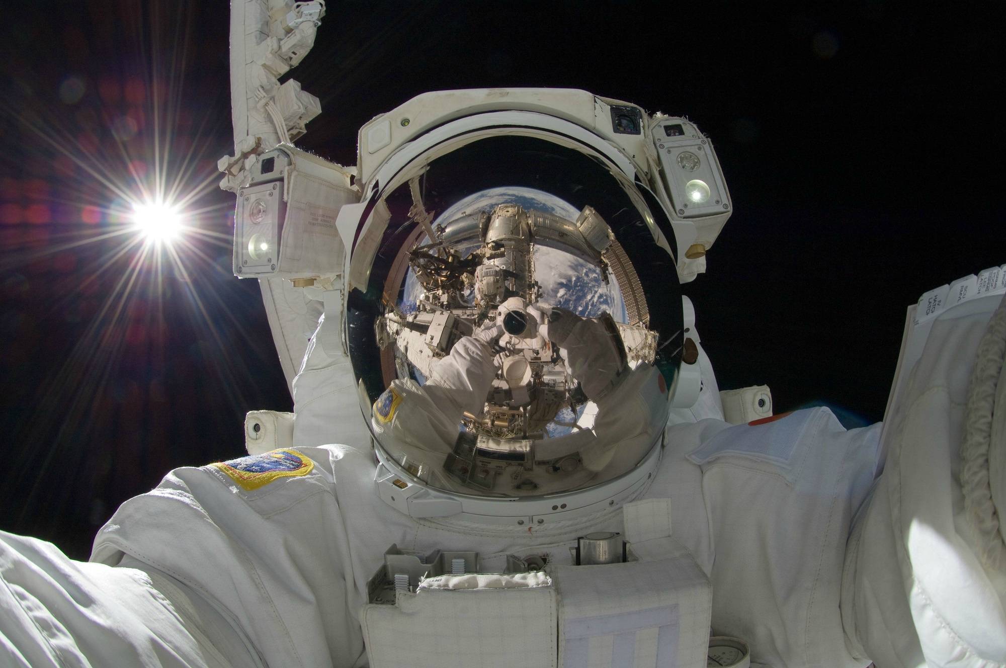 astronaut taking photos in space